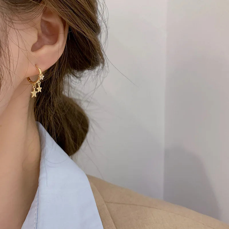 Boucles d'oreilles créoles en forme d'étoile