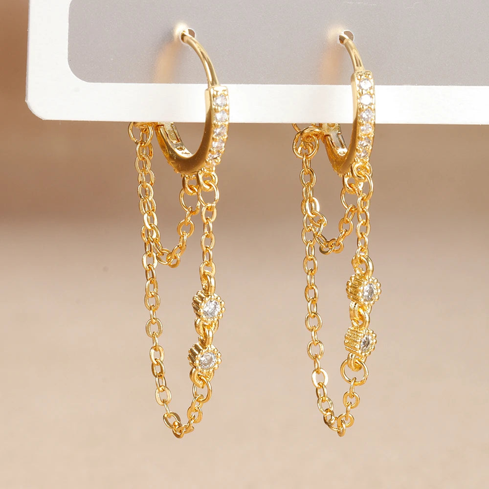 Boucle d'oreille créole avec chaîne et étoile