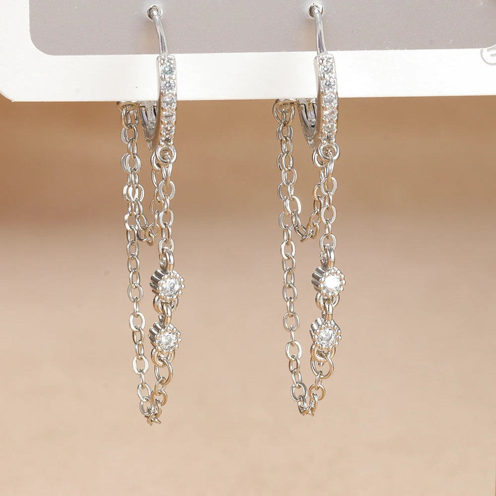 Boucle d'oreille créole avec chaîne et étoile