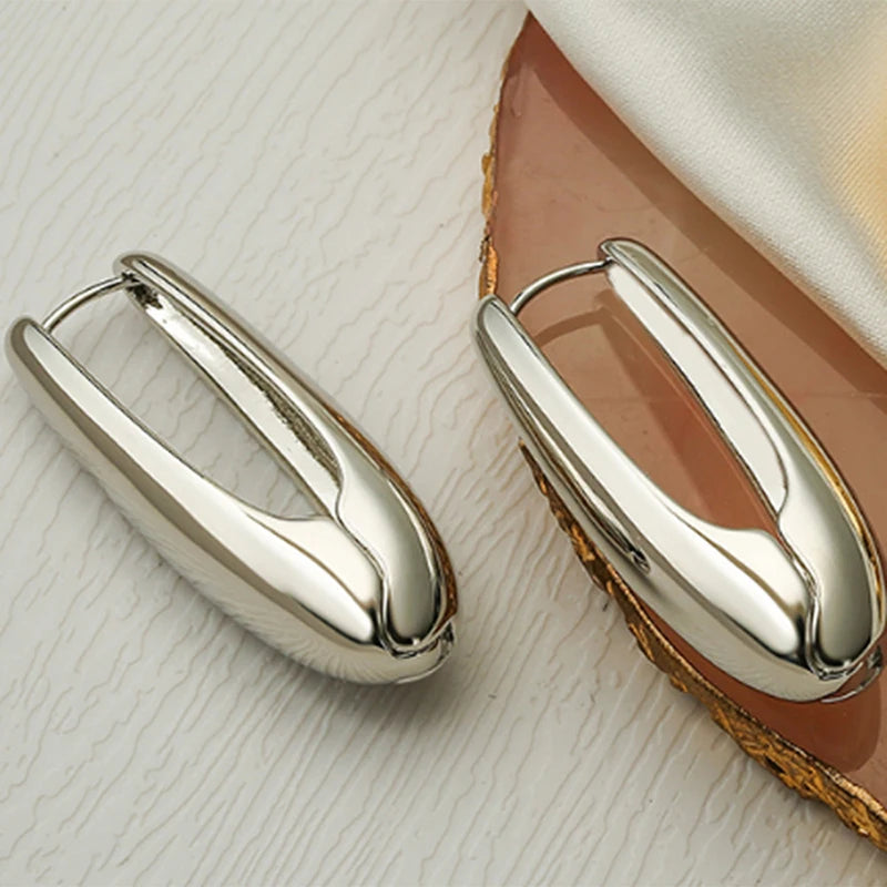 Boucles d'oreilles créoles en goutte dorées avec étoiles