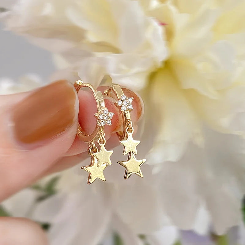 Boucles d'oreilles créoles en forme d'étoile