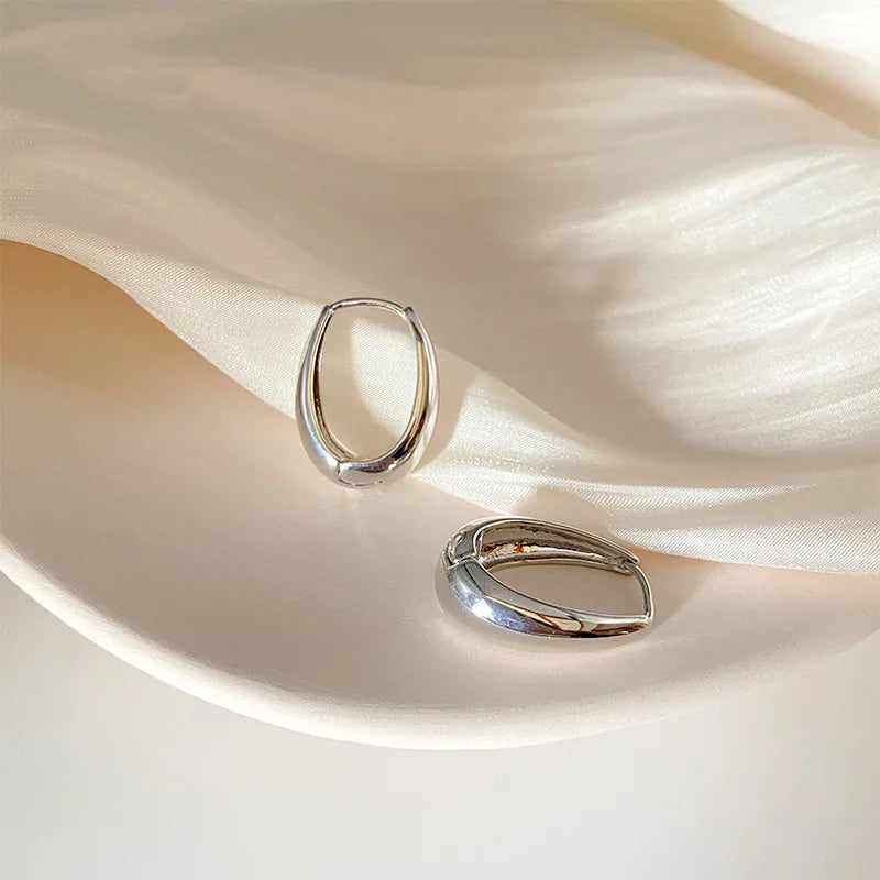 Boucles d'oreilles créoles en goutte dorées avec étoiles